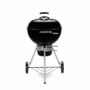 Parrilla de barbacoa negra sobre fondo verde